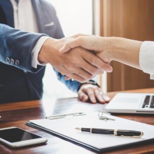 man and woman shaking hands